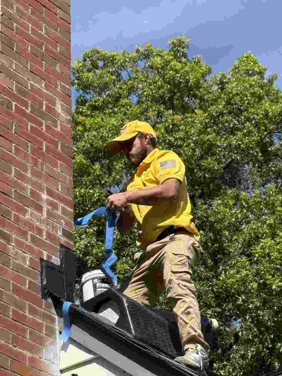 ChimCrew technician securing flashing on a chimney in Columbus